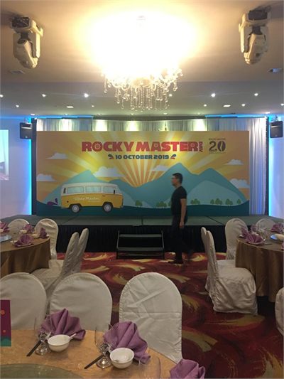 Rocky Master printed stage backdrop at a banquet hall anniversary dinner