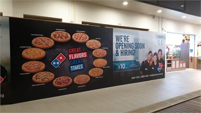 Domino's Pizza mall hoarding printed ahead of a new store opening