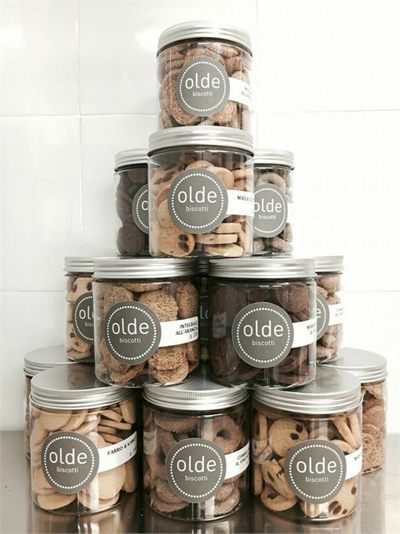 Printed paper labels applied to a stack of product jars