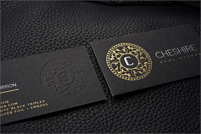 Black premium namecard printed with a gold foil emblem